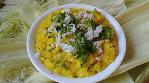 A bowl of prepared Bhutte ka Kees, a corn-based dish.