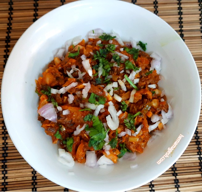 A bowl of spicy and flavorful Coimbatore Kalan mutton soup.