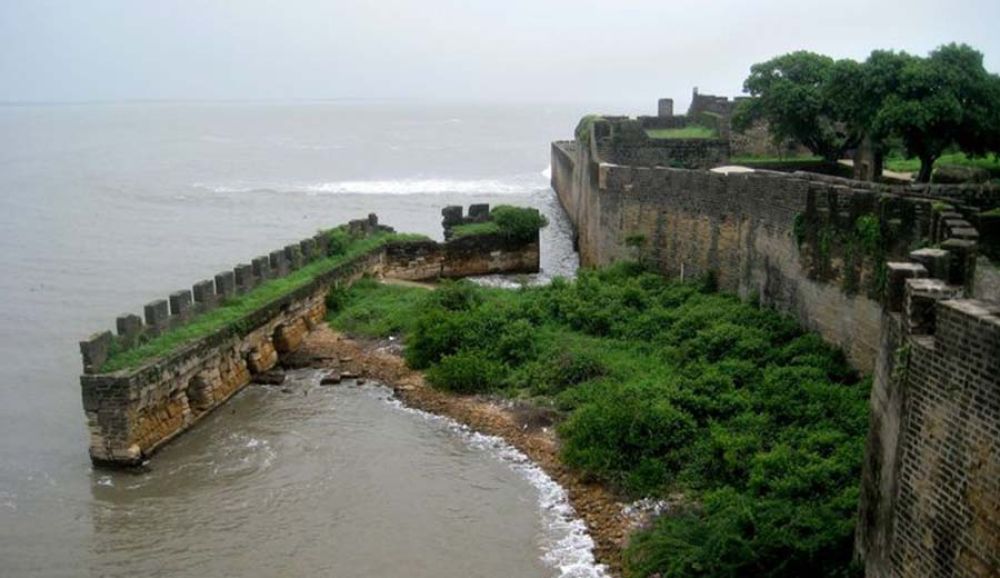 A scenic view of the lush, elevated landscapes and historic Moti Daman Fort in the union territory of Daman & Diu.