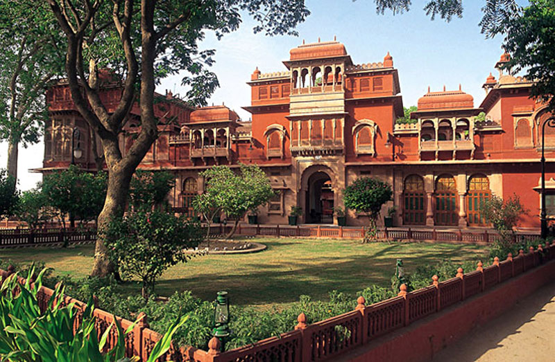 Bikaner the historic Gajner Palace reflected in the tranquil waters of its lake.