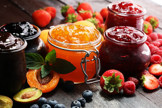 Jars of local honey and homemade fruit preserves.