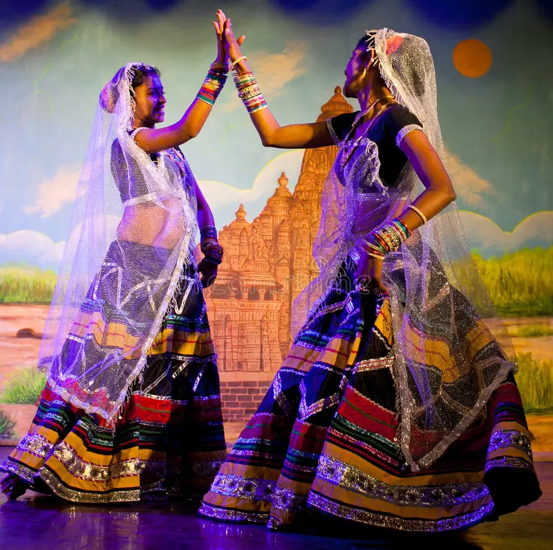 Women dancing the graceful Jhanjar folk dance in traditional attire.