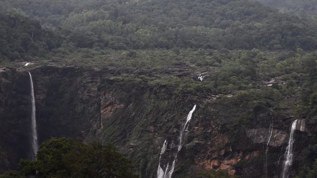 A dramatic segmented plunge of water creating massive spray and mist, showcased as one of the most impressive Central India's Famous Waterfalls.