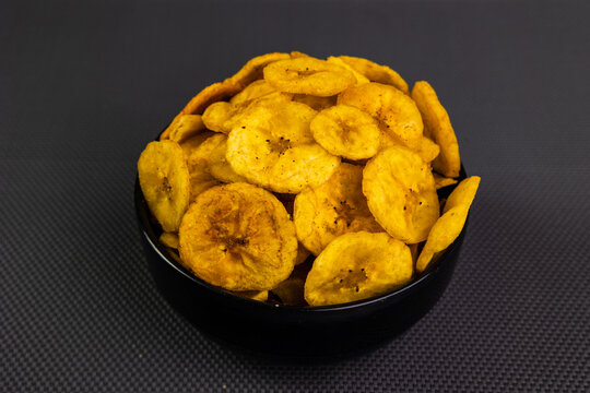 A packet of Kadalai Mittai peanut candy and crispy banana chips.