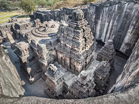 The massive monolithic Kailasa Temple, a rock-cut architectural marvel at Ellora, carved from a single basalt cliff.