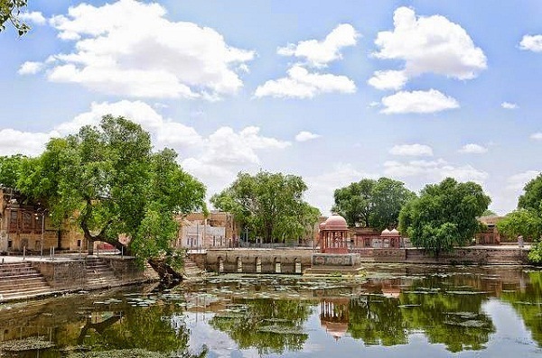 The serene ghats and holy lake at the pilgrimage town of Kolayat.