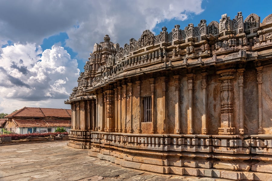 Sculpted scenes inside Krishna Mandapam, a historic cave temple place to visit in Mahabalipuram.