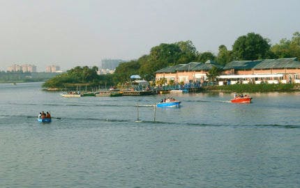 People enjoying a speed boat ride at Muttukadu Backwaters.