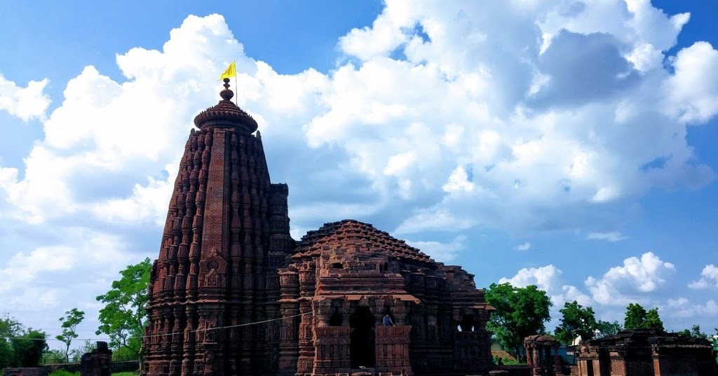The serene Shiva temple situated on an island in the Gambhir River, surrounded by water and greenery.