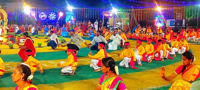 A group performing Oyilattam, a traditional silk handkerchief dance.