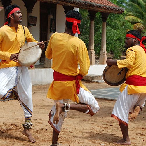 A dancer performing Oyilattam, a traditional silk scarf dance.