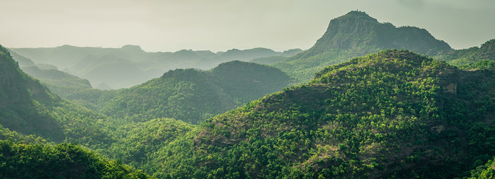Scenic hill station landscape with waterfalls and forests
