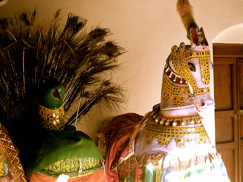 A performer in a dummy horse costume during the Poikkal Kuthirai Attam folk dance.