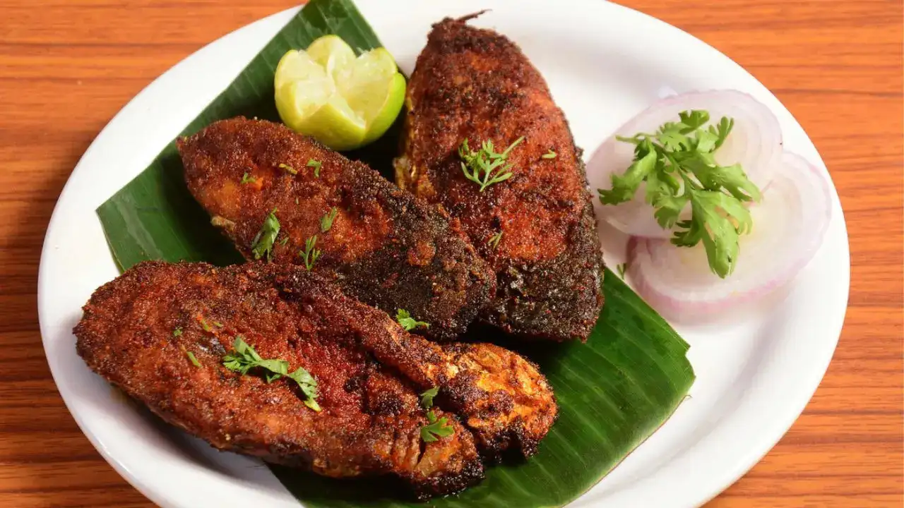 A traditional South Indian vegetarian meal on a banana leaf, showcasing Rameshwaram's cuisine.