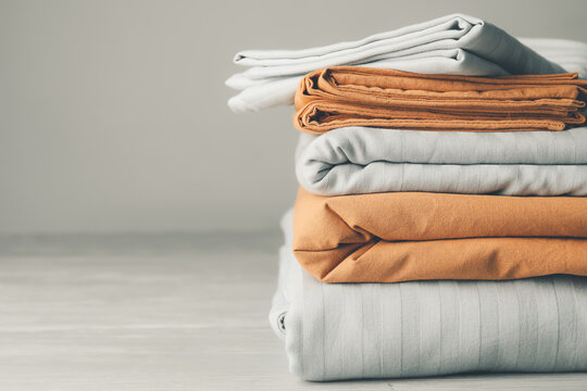 A stack of high-quality cotton bed linens from a Coimbatore mill.