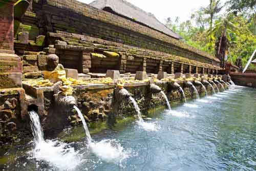 A devotee taking a holy dip in one of the 22 sacred Tirthas at the Rameshwaram temple.