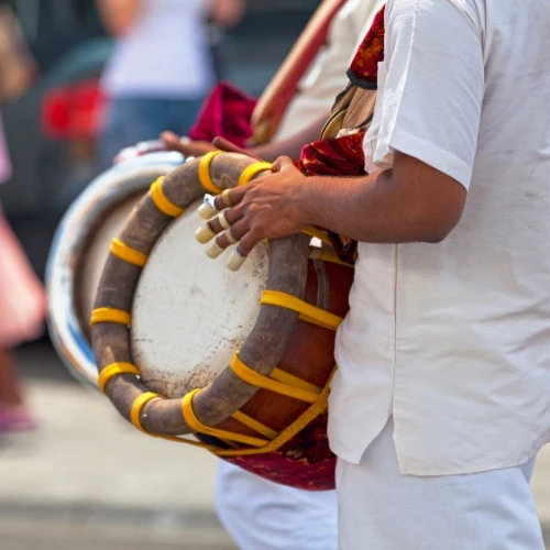 A group of devotees singing Thevaram hymns, ancient devotional songs of Rameshwaram.