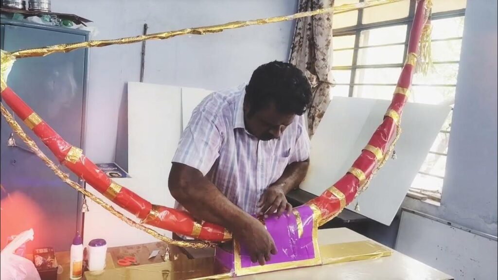 Artist performing Villu Pattu, a traditional bow-shaped instrument folk music.
