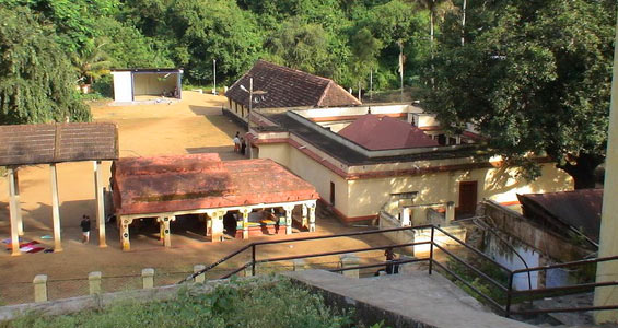 Ornate gopuram and stone carvings at the historic Aryankavu Sastha Temple.