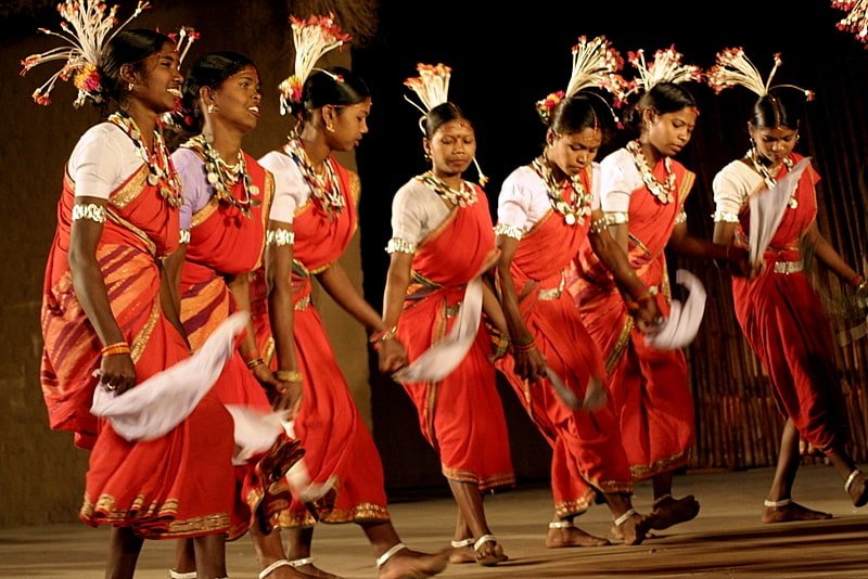 Performers in traditional attire enacting the lively Bidesia folk dance of Bihar.