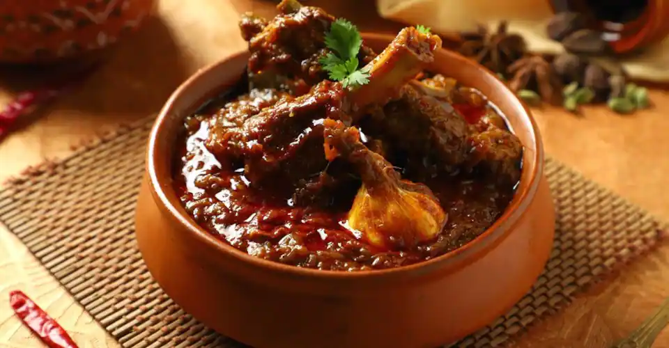 A flavorful and spicy mutton curry dish, a specialty of the Champaran region.