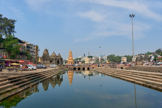 A panoramic view of the serene Godavari Ghats in Nashik during evening aarti.