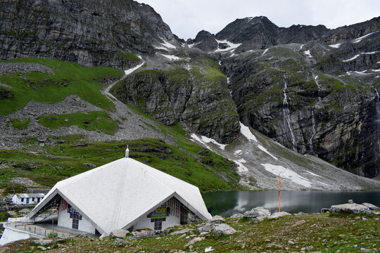 The sacred Hemkund Sahib Gurudwara and lake surrounded by seven snowy peaks.