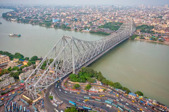The iconic Howrah Bridge spanning the Hooghly River in Kolkata, India.