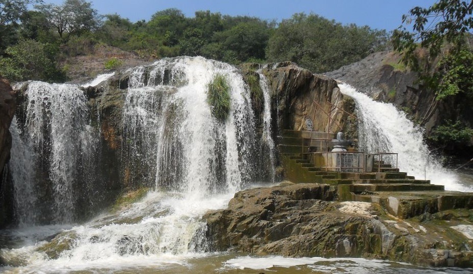 Kaigal Falls cascading over rocky steps in the Kaundinya Wildlife Sanctuary.