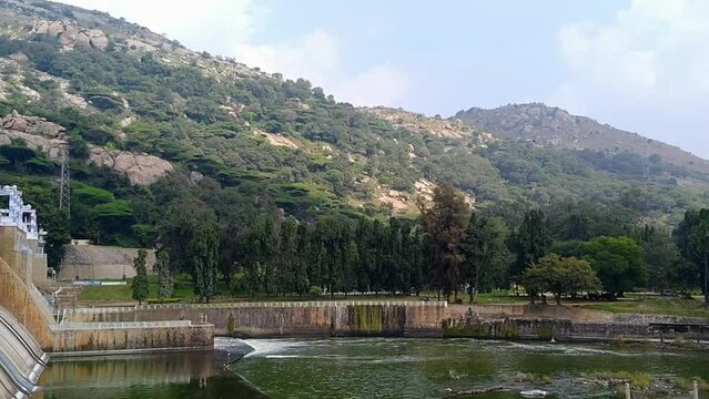 The large masonry wall and spillway of the Krishnagiri Dam.