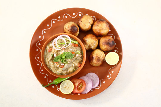 Round wheat balls (Litti) served with mashed vegetable (Chokha), a classic Bihari meal.