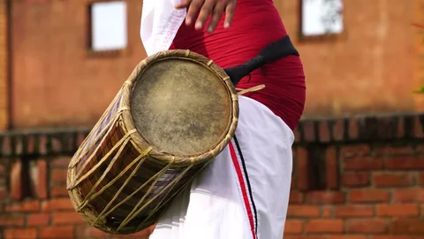 A group performing vibrant Mappila Paattu, a musical tradition of the Malabar region near Kollam.