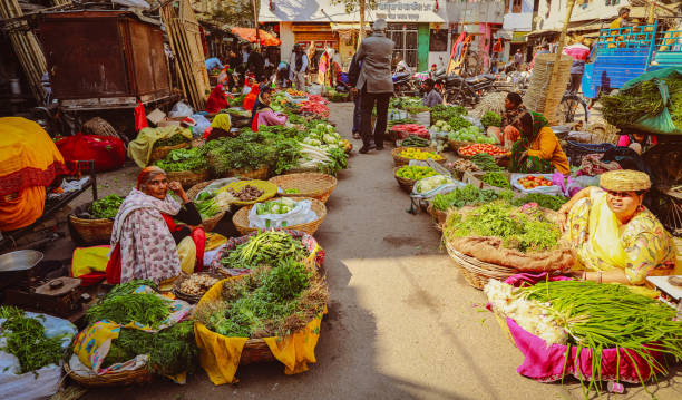 A vibrant, bustling weekly village market scene in rural Champaran.