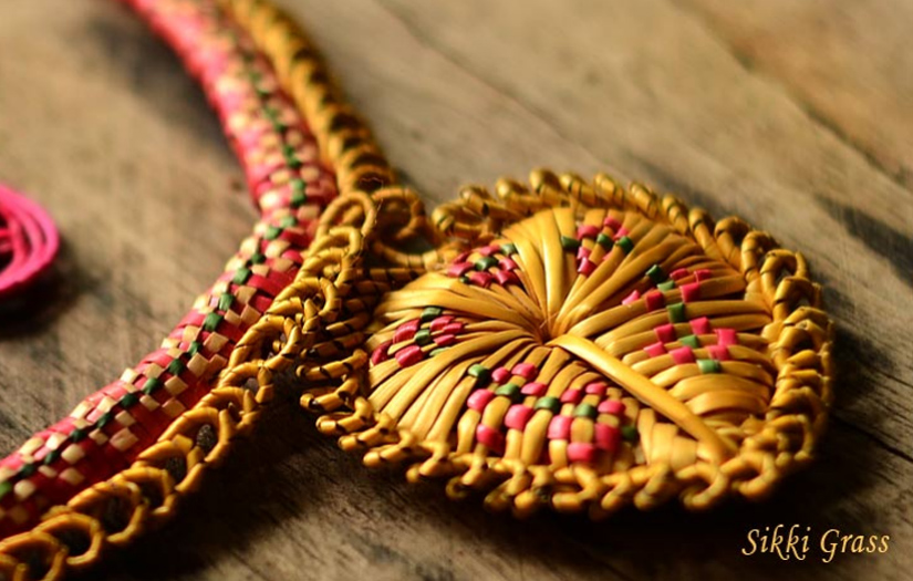 Beautifully woven baskets and figures made from golden sikki grass.
