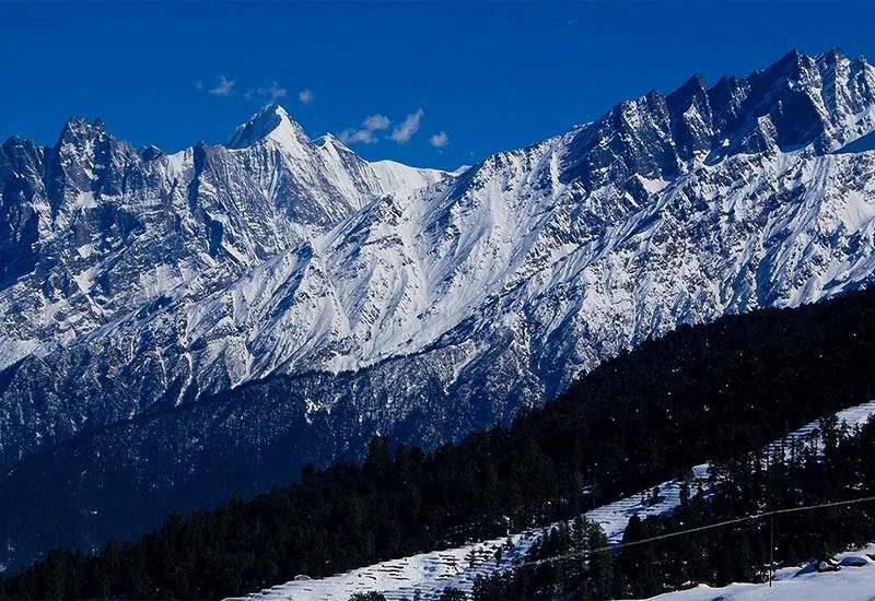 Ski slopes of Auli with Himalayan backdrop - winter adventure beyond Places to Visit in Rishikesh.