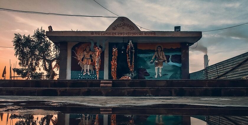 A devotee in quiet prayer at a serene temple ashram in Champaran.