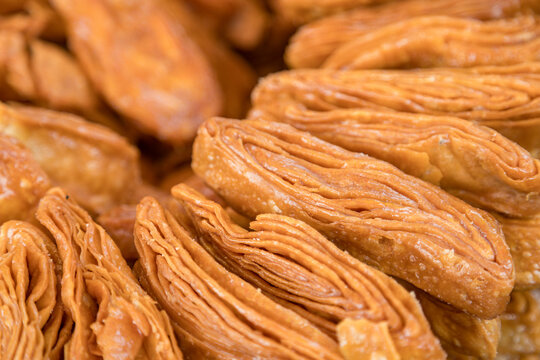 Traditional Bihari sweets - Thekua (fried wheat cookies) and Khaja (flaky pastry).