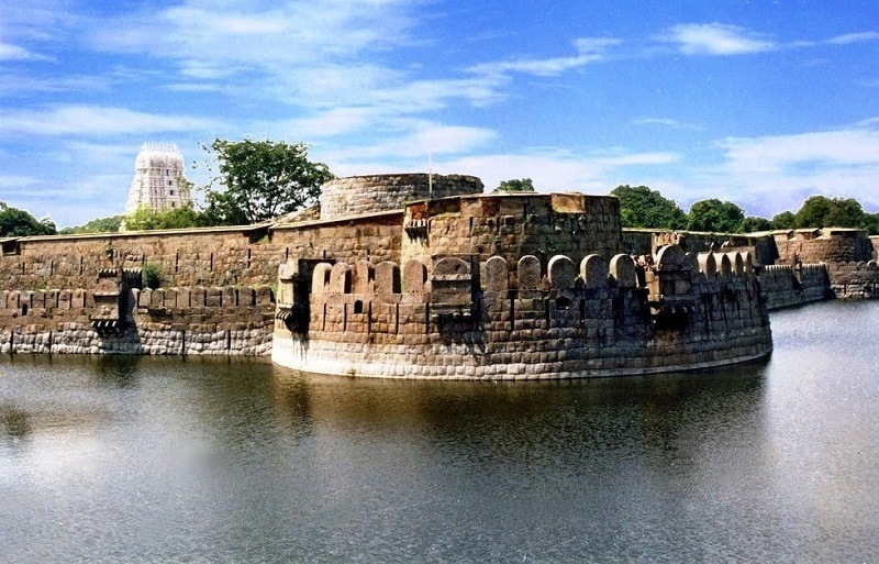 Exterior view of the historic Vellore Fort and its surrounding moat.