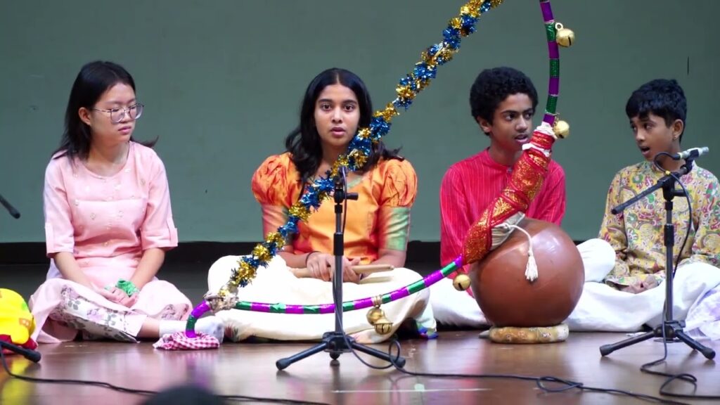 Folk artists performing the traditional Tamil narrative art of Villuppattu and the dance of Oyilattam.