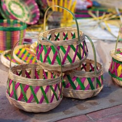 Artisans crafting bamboo and grass handicrafts.