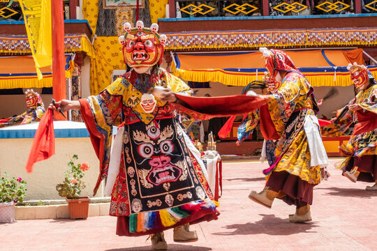 A monk in an elaborate costume performing the sacred, masked Cham dance.