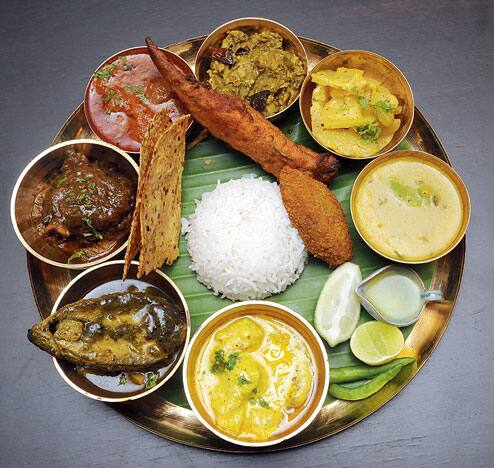 A traditional Mithila Thali meal with various regional dishes.