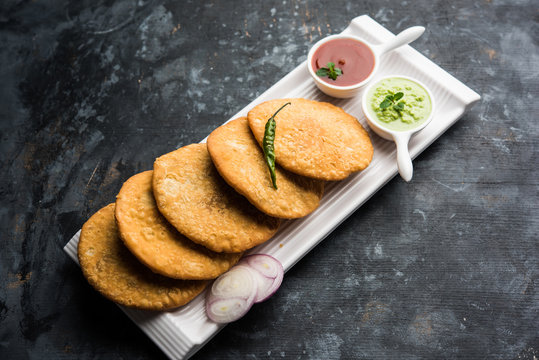 Crispy and spicy Pyaz Kachori served with chutney.