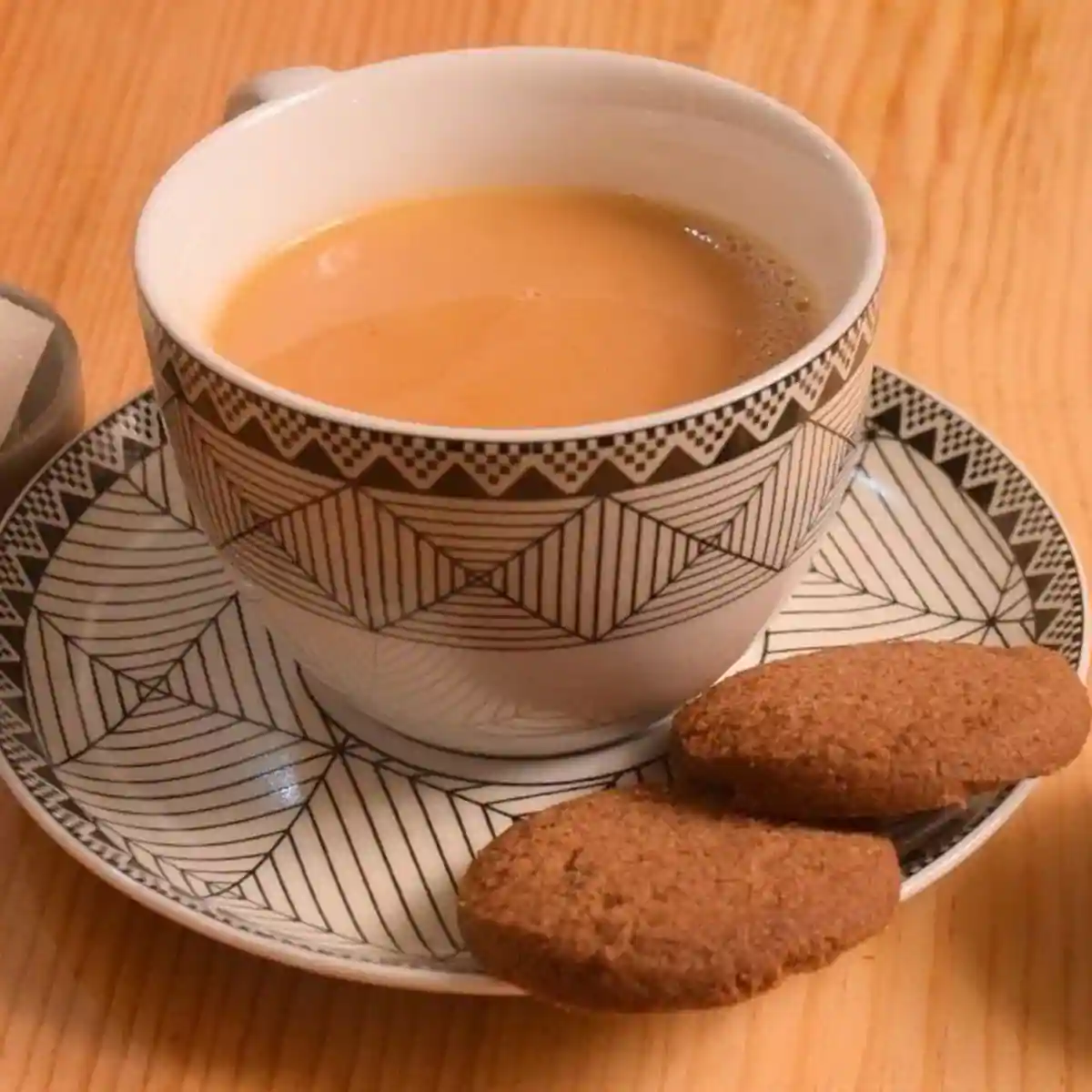 A traditional copper kettle pouring hot, salty Butter Tea.