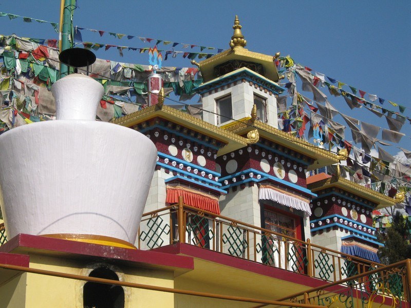 The ornate golden statues inside the Tsuglagkhang Complex monastery in Dharamshala.