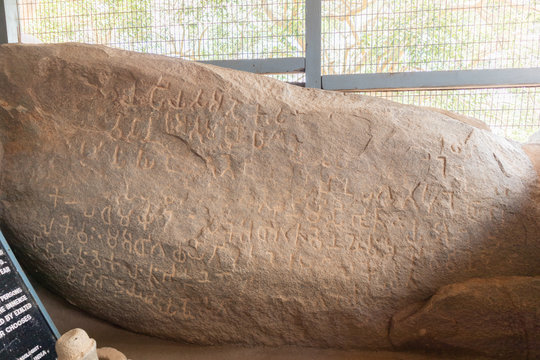 Ashoka's Rock Edicts, ancient inscriptions on a boulder, a significant archaeological place to visit in Junagadh.