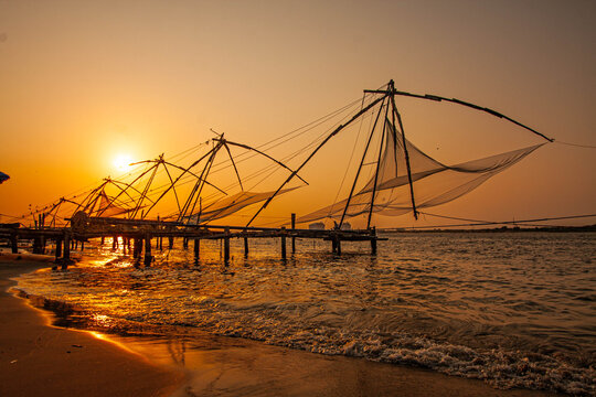 Chinese Fishing Nets at sunset, an iconic landmark place to visit in Ernakulam.