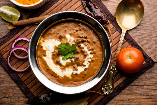 A bowl of creamy Dal Makhani garnished with fresh butter.