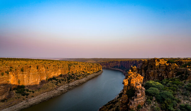 Dramatic red rock gorge and river view at the Grand Canyon of India, Gandikota.