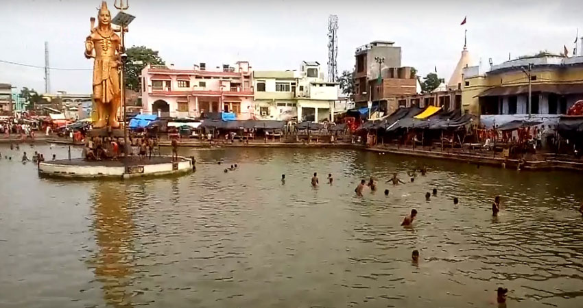 Ancient Shiva temple spire rising above Gola Gokaran Nath town.